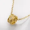 A golden cylindrical small diamond pendant necklace with a white card attached to a transparent bag Application Scenario